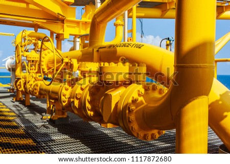 Offshore oil and Gas central processing platform and remote platform produced oil, natural gas and liquid condensate for set to onshore refinery from offshore in ocean sea background. Royalty-Free Stock Photo #1117872680