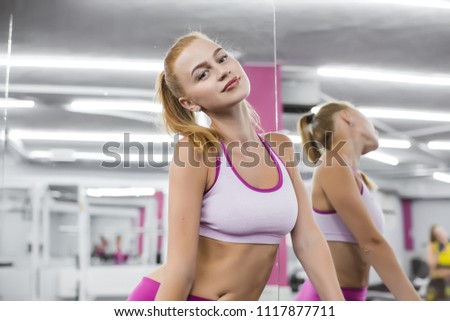 Close up portrait girl in a gym. Living healthy lifestyle concept. sporty woman, sporty athletic woman, tracksuit, girl in sportswear, sportswoman, isolated, female athlete, workout in the gym, female
