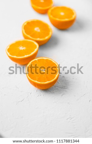 oranges on white plaster, stone background, place for text, for logo