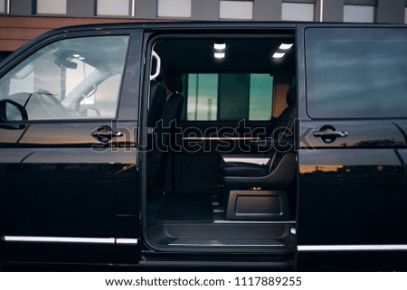 Luxury and comfortable van with an open door. A VIP van is prepared for the transportation of passengers. Transfer from airport with a comfortable seats and free space  Royalty-Free Stock Photo #1117889255
