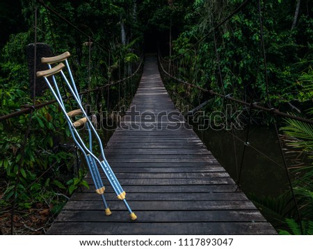 crutch on the wooden Suspension bridge