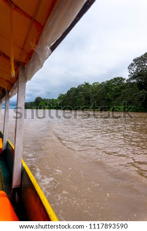 Sailing the Amazon River in a boat in Loreto, Peru.