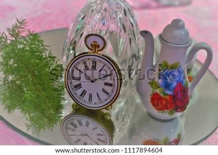 Mini coffee pot and clock decorating table