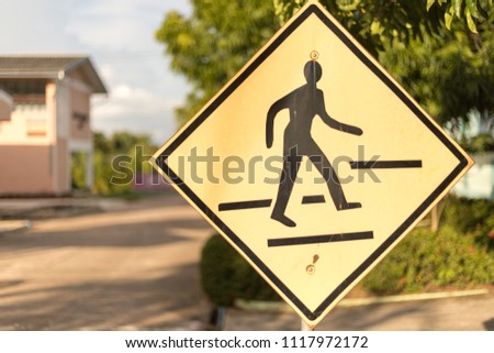 School sign.Traffic sign road on blur road abstract background.