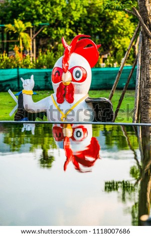 Chicken statue in park, Thailand.