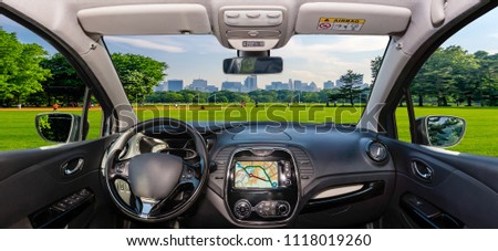 Looking through a car windshield with view over Central Park and a beautiful contrast between skyscrapers and buildings, Manhattan, New York City, USA