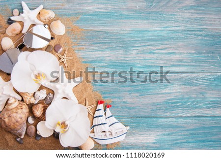 Sea decorations and shells on a  wooden background