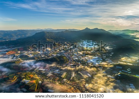 Aerial view of Don Duong town, Da Lat city, Vietnam. Fog on top of city in the morning.