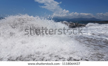 waves splash foam in summer sea Preveza Greece