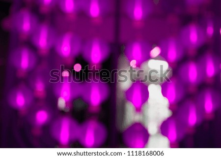 Violet glitter textured blurred background.