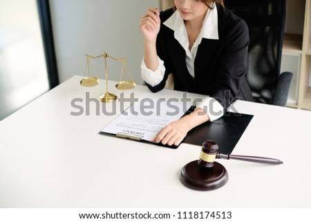 Lawyer working on a documents. Legal law, advice and justice concept.