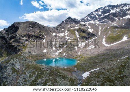 Tourquise lake in mountain, Alps. Aerial shot