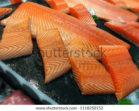 Fresh salmon fish slide for selling in supermarket in Thailand.