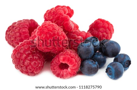 raspberry and blueberries isolated on white background.