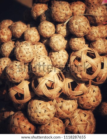 Many basketball balls are sold in the market.