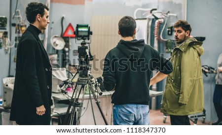Behind the scene. Film crew team filming movie scene on studio. Group cinema set
