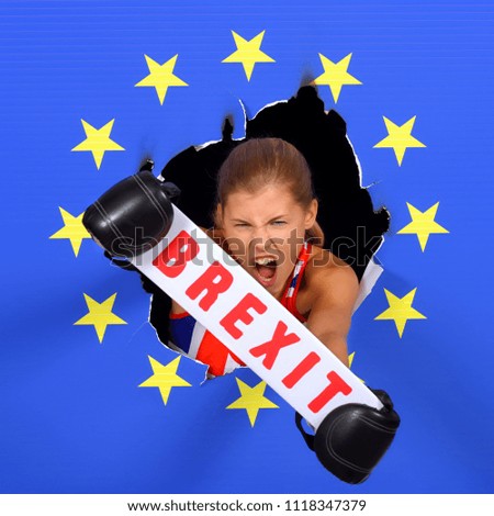 An angry British girl holds a red sign up with the word Brexit 
on it. She stands in front of the camera  and demonstrates that 
she is angry about the EU situation.