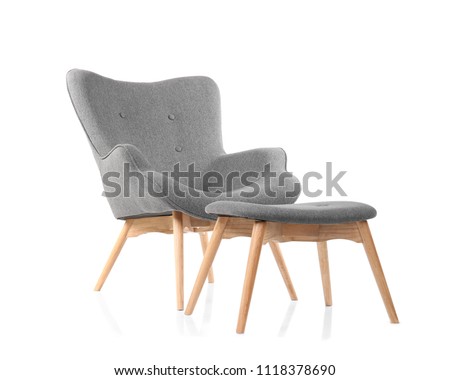 Comfortable armchair and footstool on white background Royalty-Free Stock Photo #1118378690