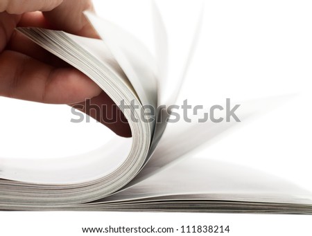 Turning over pages of thick magazine Royalty-Free Stock Photo #111838214