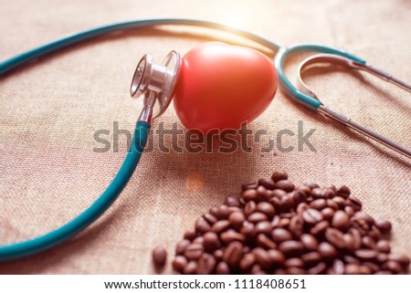coffee beans and stethoscope and red heart in concept Health of coffee drinkers, quality of coffee