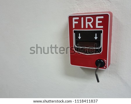 Test Fire alarm switch on white wall.