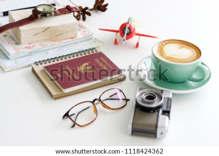 Passport Thailand and travel planning in the morning -Stock image Passport, Thailand, map, book, book, coffee mug - drink, glasses, vintage camera, airplane models
