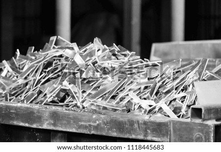 aluminum scrap in foundry for melting, black and white photo