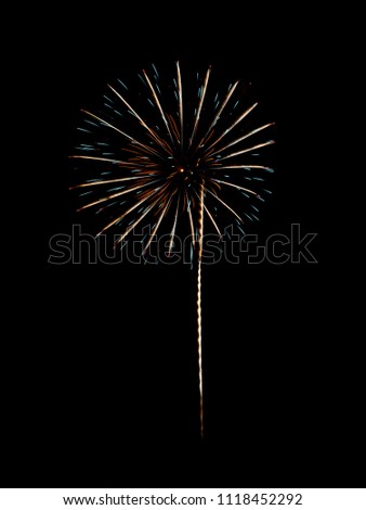 Green and yellow fireworks on night sky background