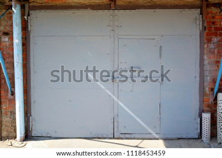 Brutal garage doors are light gray.