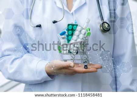Medic shows a basket of drugs in the blurred background.