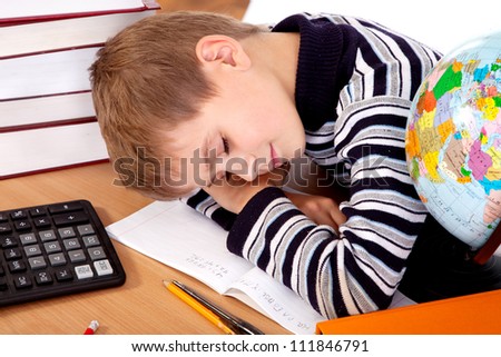 Tired schoolboy isolated on a white background