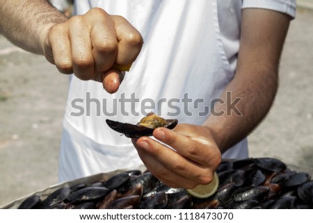 Turkish people eating mussle