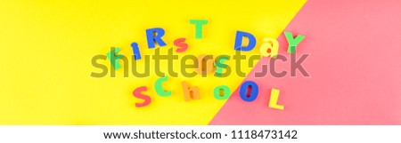 Creative flat lay back to school concept with welcome letters message on bright yellow and pink paper background with copy space, template for text or design. Long wide banner