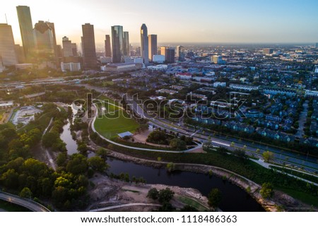 Entire skyline cityscape drone view at Golden sunrise Houston Texas sunrise aerial drone view golden hour ring around horizon y’all skyscrapers downtown skyline cityscape with traffic and highways