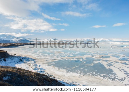 Panoramic view of a beautiful cold winter landscape with icebergs in Jökulsárlón glacial lagoon, Vatnajökull National Park, southeast of Iceland, Europe.