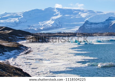 Beautiful cold winter landscape with icebergs in Jökulsárlón glacial lagoon, Vatnajökull National Park, southeast of Iceland, Europe.