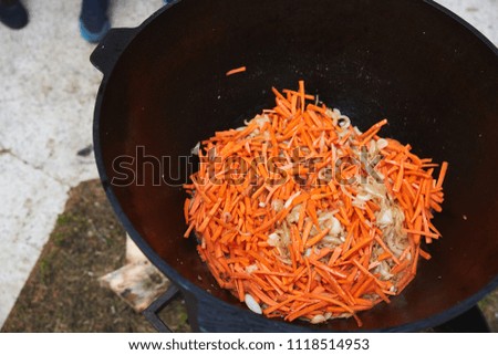 carrot and onion simmer in a saucepan