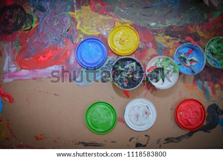  painted in bright colors with hand or fingers