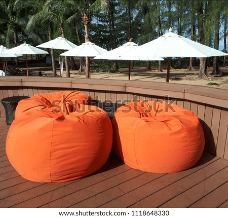 Orange foam seat at a swimming pool.