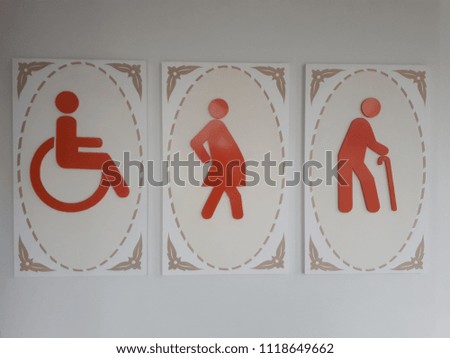 Toilet sign on the wall.