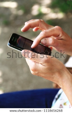 mobile phone in hand stock photo