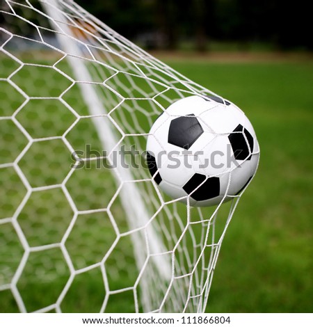 soccer ball in goal Royalty-Free Stock Photo #111866804