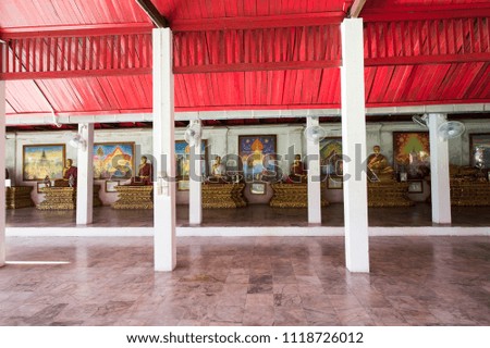 sermon hall of Wat Prathat Hariphunchai that contain a lot of Buddha statue, Buddhist statue and Art pictures 