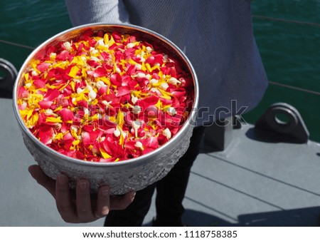 Colourful petal of flower prepared for scatter on water in funeral ceremony, Southeast Asia traditional