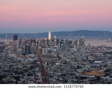 Aerial sunset view of skyscrapers and city of San Francisco at Twin Peaks, California, United States. Top view.