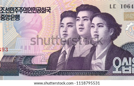 Young professionals. Portrait from North Korea 50 Won Banknotes. Male workers and women workers behind a monument. North Korea money. North Korea bank note. Closeup Collection.