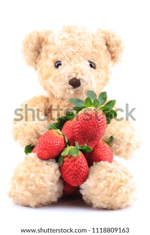 Brown bear and strawberry on a white background.