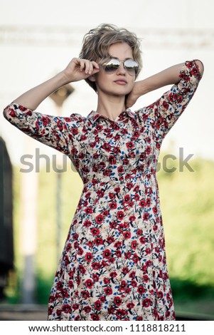 girl posing on the railroad, portrait, artistically crafted photograph, retouching, selective focus