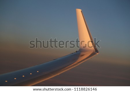 Wing of a passenger aircraft in the golden sunset light in the evening in flight
June 4, 2018