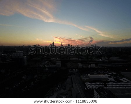 Aerial drone image flying towards central London, England during a brilliant sunrise.